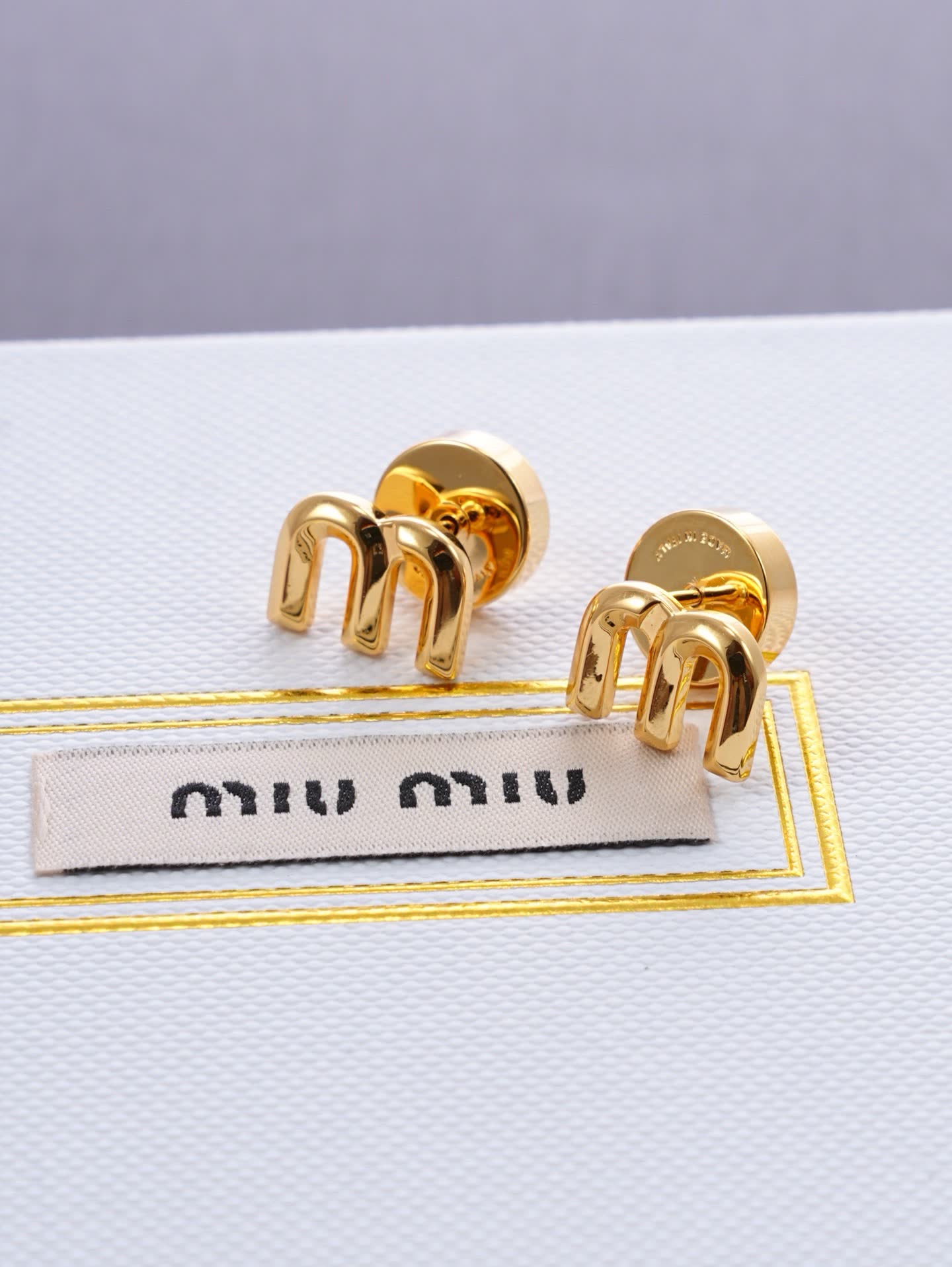 Miu Miu Gold Tone 'M' Stud Earrings